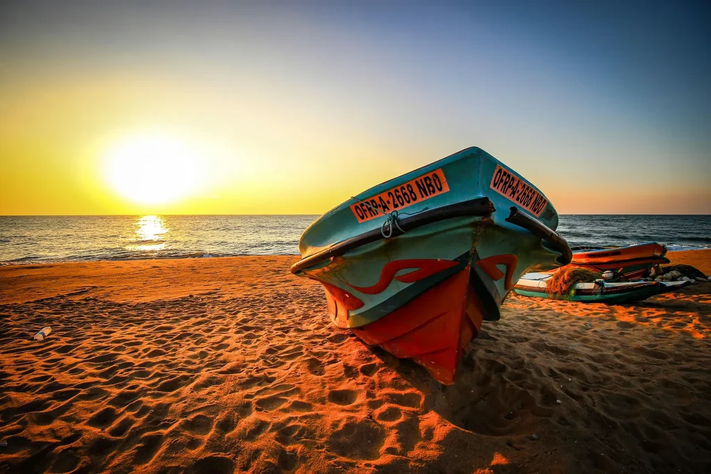 negombo fishing boat on beach at sunset