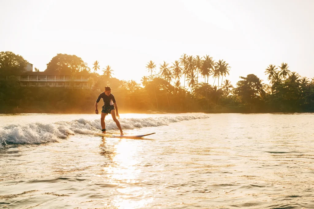 surfing at sunset weligama sri lanka